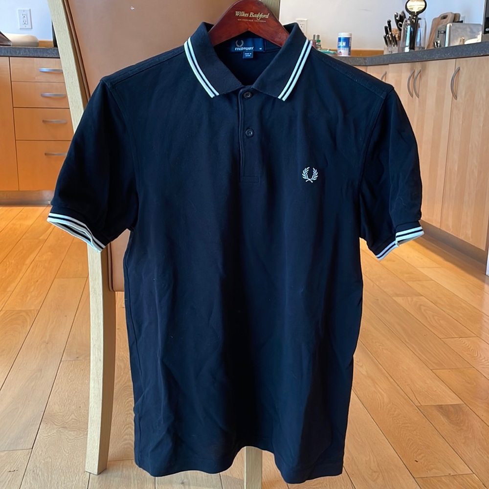 Fred Perry polo shirt. Black with white accents.